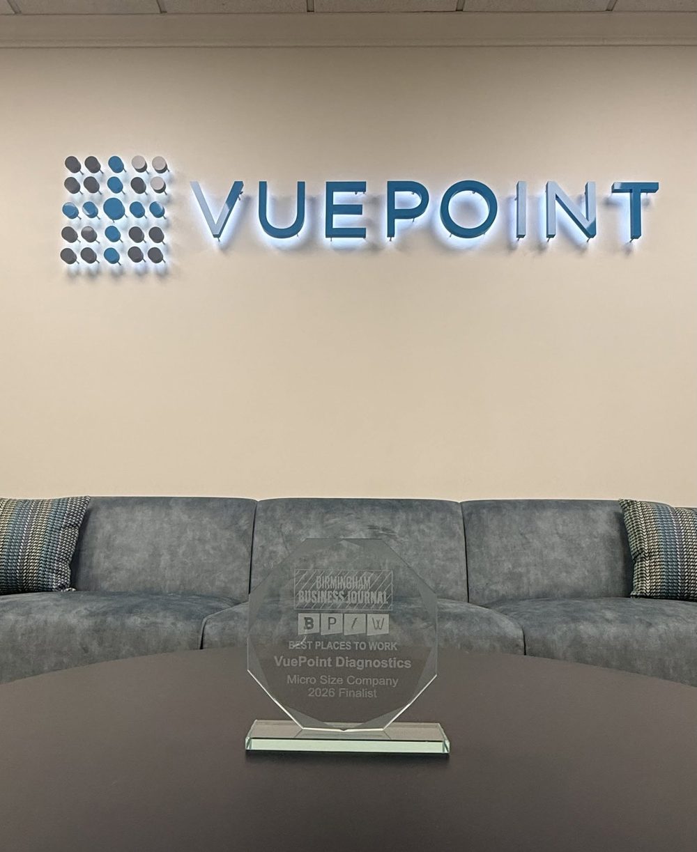 The 2026 Birmingham Business Journal Best Places to Work award on a table beneath the VuePoint lobby sign